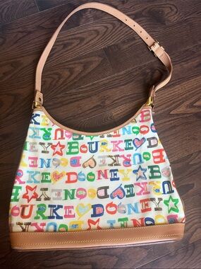 Dooney & Bourke Multicolor Logo Shoulder Bag with Tan Leather trim. EUC
